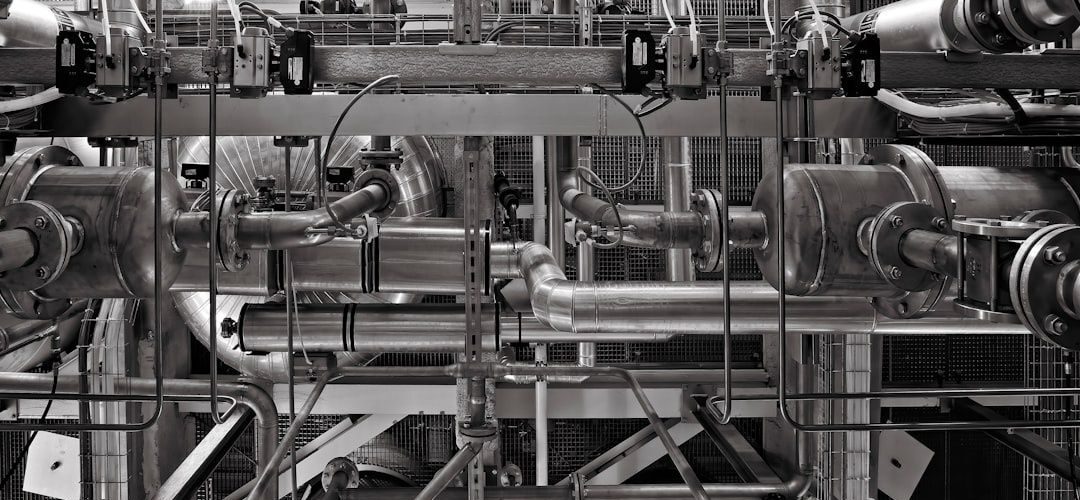 Complex industrial piping and machinery in a modern plant