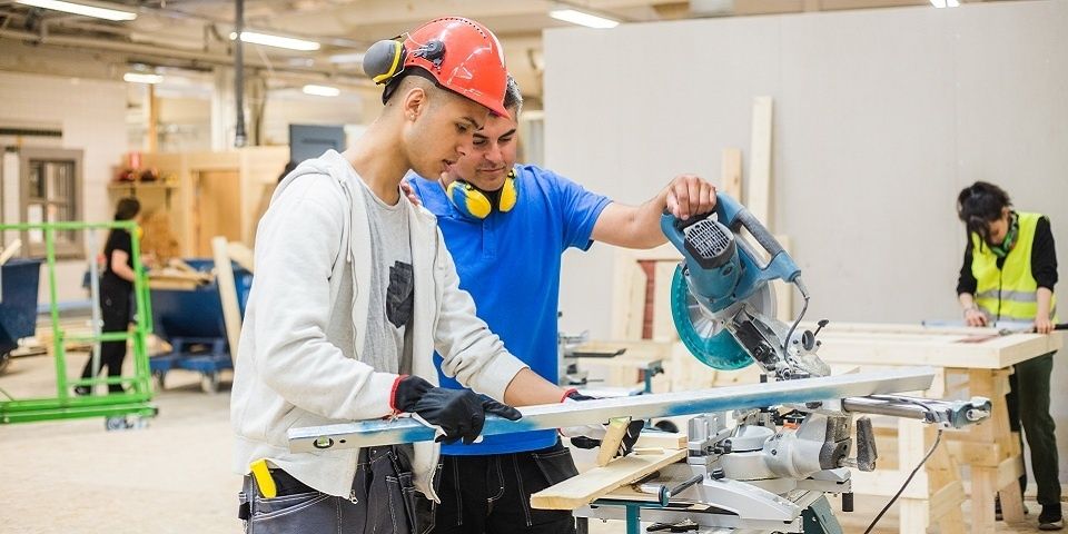 Apprentices receive hands-on woodworking training in a workshop